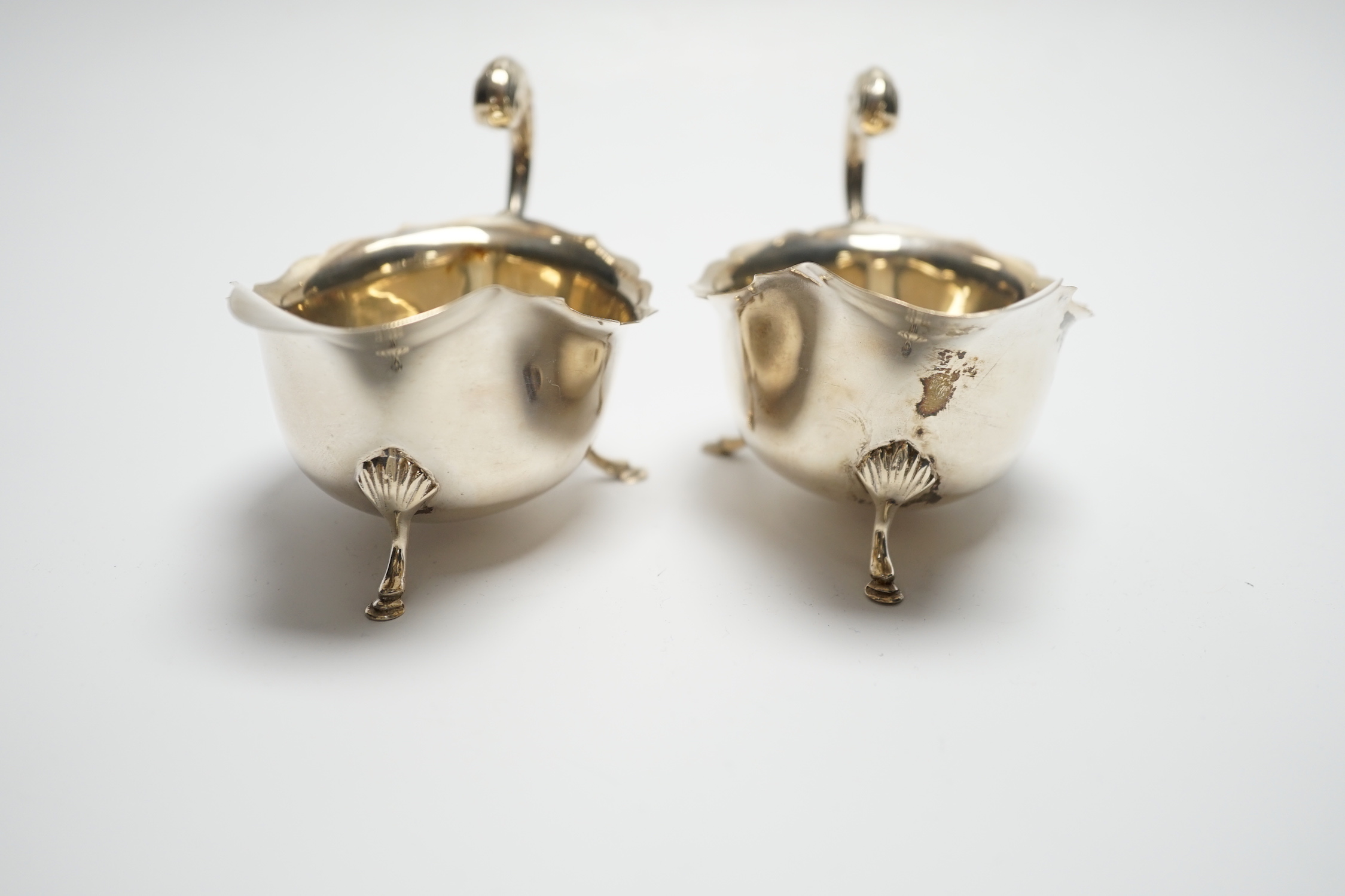 A pair of George V silver sauceboats, with flying scroll handles, S. Blanckensee & Sons Ltd, Birmingham, 1927, length 15cm, 4.7oz.